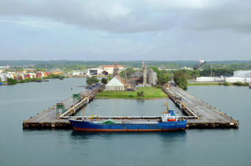 An old cargo ship berthing in the port of Cristobal, Panama.