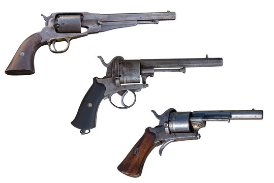 Three old revolvers. Ancient weapon.