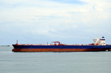 Fototapeta premium Cargo ship entering Panama Canal in the Cristobal, Panama. 