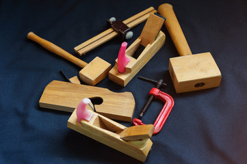 Woodworking. Joiner's works. Joiner's tools on dark background