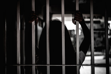 Hands of women desperate to catch the iron prison,prisoner concept,thailand people,Hope to be...