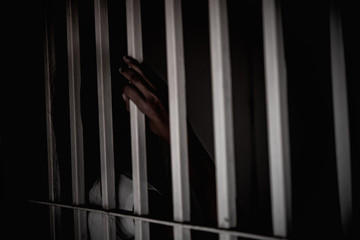 Hands of women desperate to catch the iron prison,prisoner concept,thailand people,Hope to be...