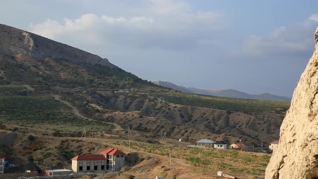 Mountains near Sudak town. Sunset view from ancient Sudak fortress. Crimea.