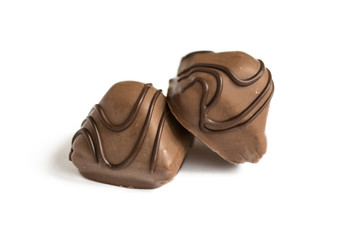 Chocolate candy isolated on white background. Chocolate truffle sweets closeup.