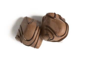 Chocolate candy isolated on white background. Chocolate truffle sweets closeup.