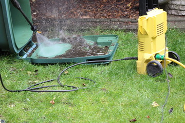 washing out the wheelie bin