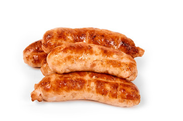 Meat sausages with glitter on a light background. Fried sausage. The concept of traditional cuisine.