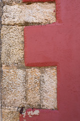 Red wall with stone bricks