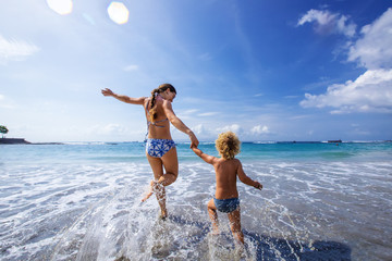 A family is having fun at the seashore - 272301428