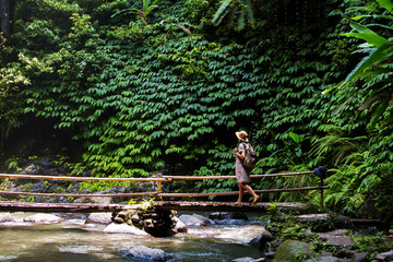 Woman near Nung Nung waterfal on Bali, Indonesia