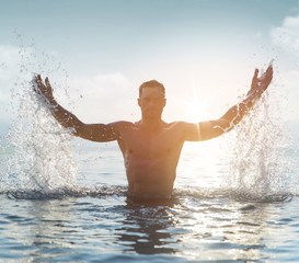 Portrait of a serious man in a tropical pool