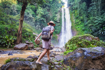  Woman near waterfal Git Git on Bali, Indonesia 