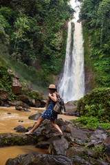  Woman near waterfal Git Git on Bali, Indonesia 