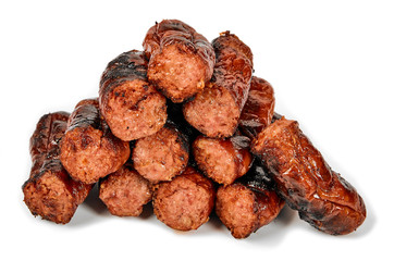 Meat sausages with glitter on a light background. Fried sausage. The concept of traditional cuisine.