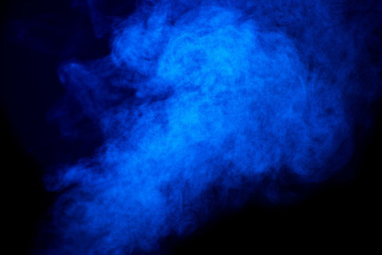 Bright blue smoke isolated on black background