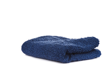 Dark blue terry towel isolated on white background.