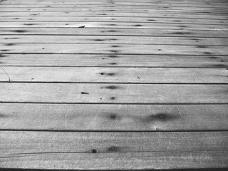 rough wooden or plank flooring with nails in black and white color