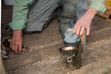 People kindle device for fumigating the bees with smoke.