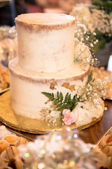 Delicious decorated cake at festive dessert party table