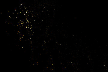 Gold abstract bokeh. Black background. Holyday concept