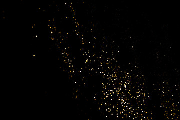 Gold abstract bokeh. Black background. Holyday concept