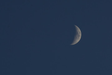 Obraz na płótnie Canvas Crescent moon in the evening sky. Concept - an evening of memories