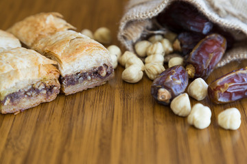 Turkish style vegan baklava or Antep baklava with nut,date fruit, pistachio for presentation and service and food photography. 