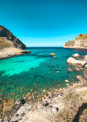 Fototapeta na wymiar Beautiful coastline view of the mountain cliff with turquoise water beaches ant the wild nature. Cala Figuera, Serra de Tramuntana, Cap de Formentor, Mallorca, Spain