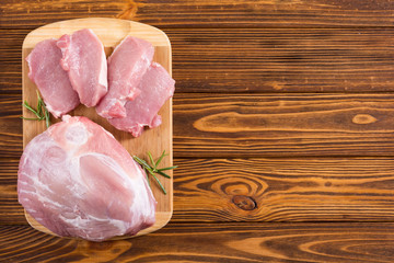 Raw pork meat on wooden background