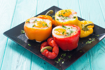 Baked pepper stuffed with bacon and eggs