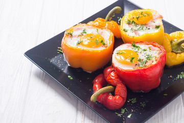 Baked pepper stuffed with bacon and eggs