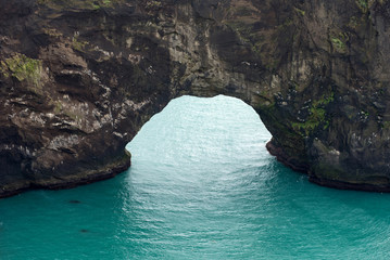Dyrholaey rock arch in the Atlantic ocean, Iceland