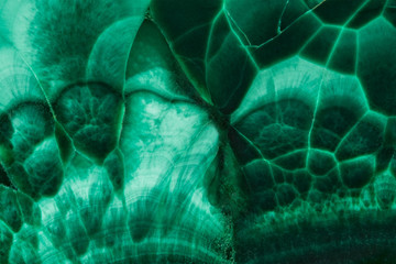 The green malachite. An ornamental stone. Photo texture. Macro.