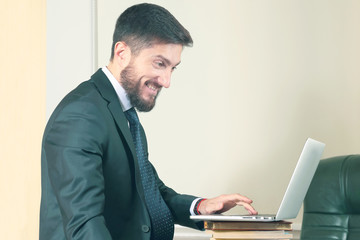 business man in office working with laptop