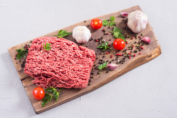 Raw minced beef meat with spices and herbs