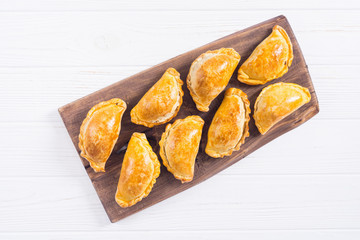 Latin American baked beef empanadas with sauce