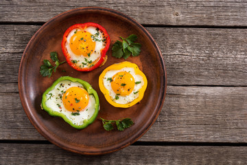 Yellow , red and green pepper with fried eggs