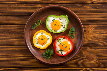 Yellow , red and green pepper with fried eggs