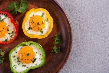 Yellow , red and green pepper with fried eggs