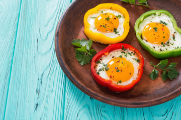 Yellow , red and green pepper with fried eggs