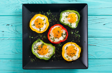 Yellow , red and green pepper with fried eggs