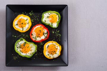 Yellow , red and green pepper with fried eggs