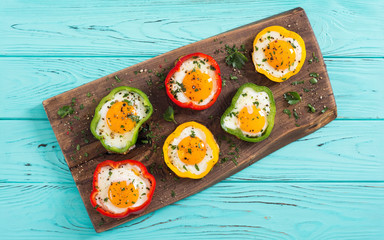 Yellow , red and green pepper with fried eggs
