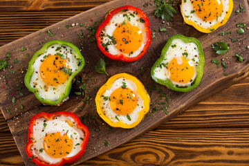 Yellow , red and green pepper with fried eggs