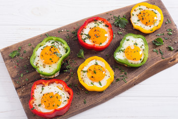 Yellow , red and green pepper with fried eggs