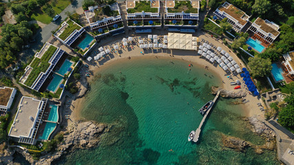 Aerial top view photo of tropical sandy paradise beach with pool facilities in exotic island