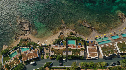 Aerial top view photo of tropical sandy paradise beach with pool facilities in exotic island