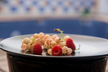 black dish with freshly  sweet berries