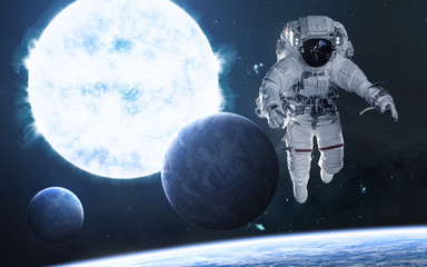 Blue giant star. Astronaut, planets in deep space. Science fiction. Elements of this image...