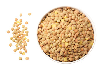 lentils in a white plate isolated on white background. top view